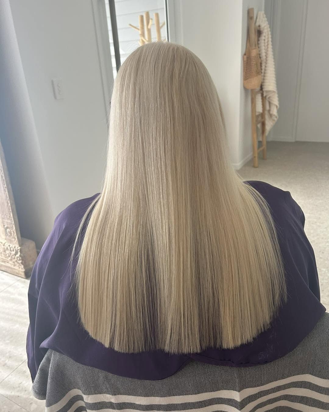 Long, sleek blonde hair by Emma Parmar Hair